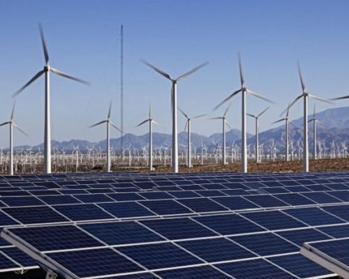 view-of-wind-and-solar-farm-in-desert-696x463-696x463